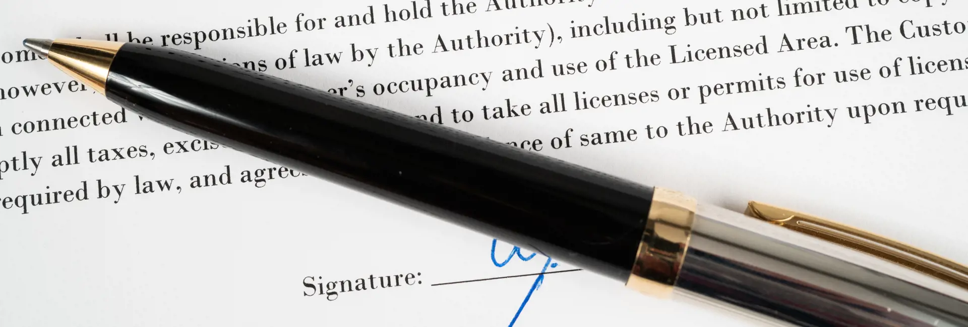 Terms and Conditions' document with a black and gold pen, representing Scan Global Logistics' policies