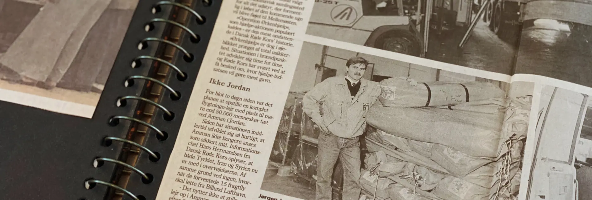 Vintage newspaper clipping showcasing the early days of Scan Global Logistics, featuring a worker with cargo