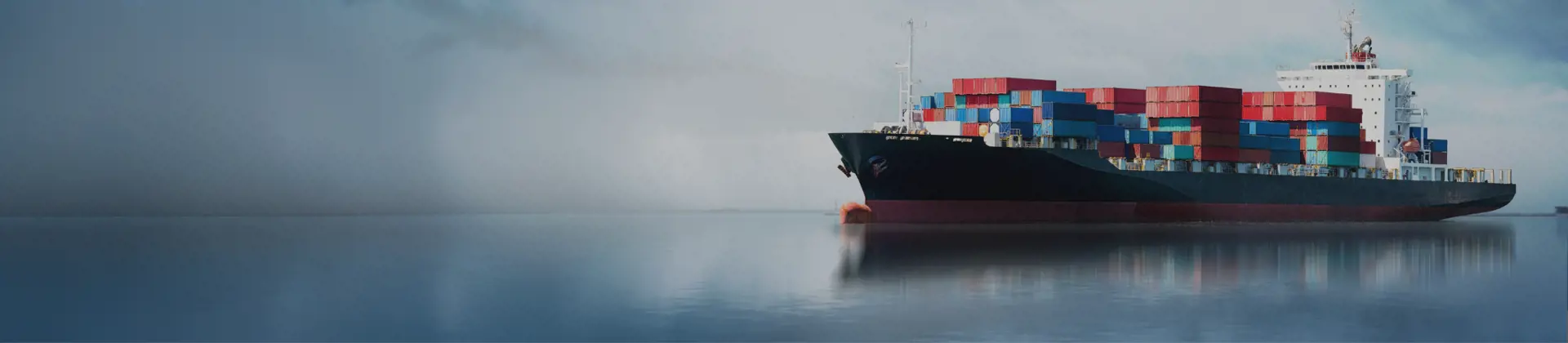 Container ship under a dramatic sky, showcasing optimized end-to-deck logistics solutions by Scan Global Logistics