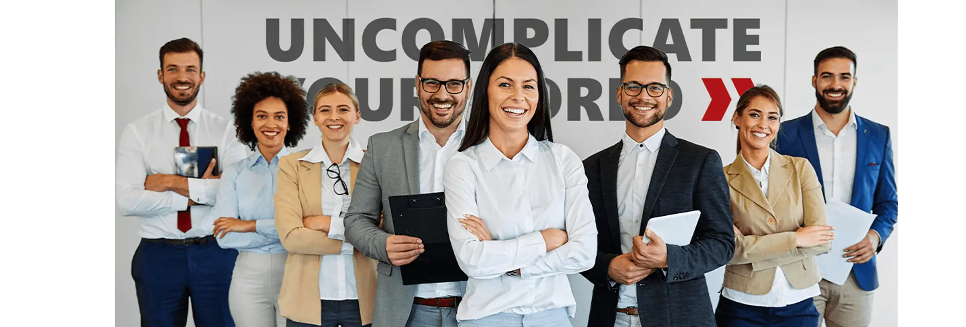 Smiling team of professionals at Scan Global Logistics, representing employee engagement and diversity