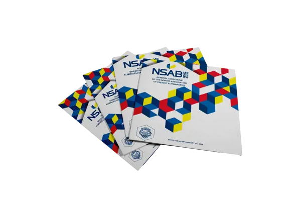 Stack of NSAB 2015 booklets with colorful geometric patterns, outlining the general conditions for freight forwarders